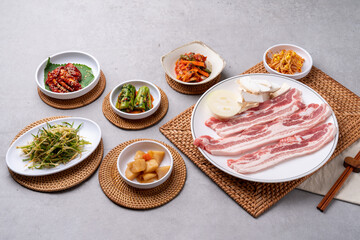 Korean food, budae jjigae, galbitang, earthen pot, bulgogi, pork belly, grilled, side dishes, kimchi, cucumbers, potatoes, vegetables