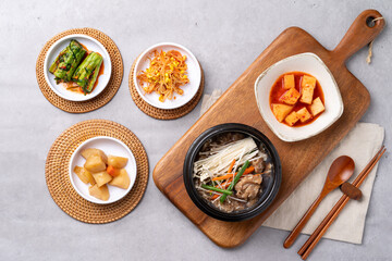 Korean food, budae jjigae, galbitang, earthen pot, bulgogi, pork belly, grilled, side dishes, kimchi, cucumbers, potatoes, vegetables