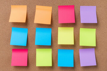 Colorful Organization - Array of Multicolored Sticky Notes on Cork Board