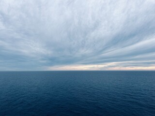 Naklejka na ściany i meble Sunset sea horizon, cloudy sky, dark cloudy sky at the seascape