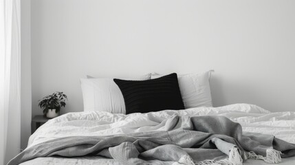 Fototapeta na wymiar Minimalist Bedroom with White Linens and Black Pillows