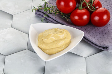 Dijon mustard sauce in the bowl