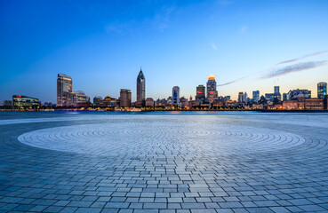 City Square floor and Shanghai skyline with modern buildings at dusk. Famous Bund buildings scenery...