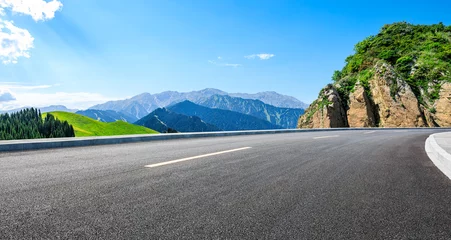 Fototapeten Asphalt highway road and green forest with mountain nature landscape under blue sky © ABCDstock