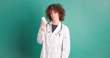 Disapproving young woman doctor with medicine bottle