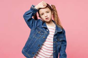 Little sick ill child sad kid girl 7-8 years old wears denim shirt put hand on forehead suffer from...