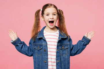Little child surprised shocked cool cute kid girl 7-8 years old wearing denim shirt have fun...