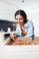 Woman enjoying pizza in a box with a glass of milk delicious and satisfying meal concept