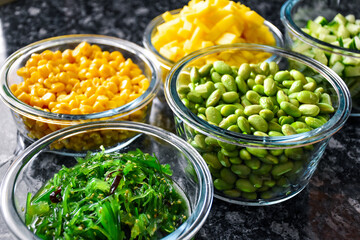 Glass bowls with vegetables and fruits