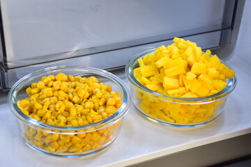Mango and corn in the refrigerator