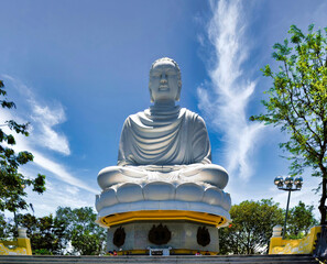 Fototapeta premium Big Buddha statue at the Long Son Pagoda or Chua Long Son, a Buddhist temple in the city of Nha Trang in south Vietnam
