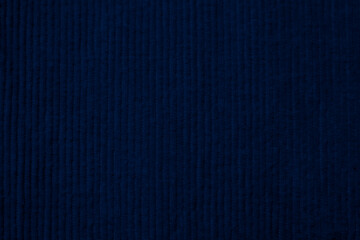 Dark blue corduroy fabric texture used as background. clean fabric background of soft and smooth...