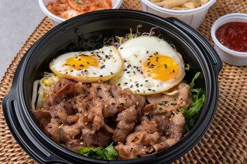 Korean food, bulgogi, bibimbap, beef, vegetables, eggs, side dishes, kimchi, fried tofu, red pepper paste