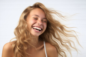 Young pretty blonde girl over isolated white background