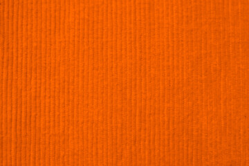 orange corduroy fabric texture used as background. clean fabric background of soft and smooth...