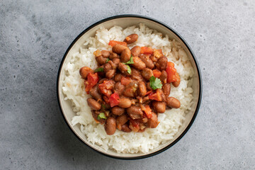 Vegan bean curry with rice and tomatoes. Indian cuisine. Vegetarian dish. 