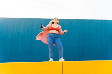 Beautiful plus size young woman outdoors - Confident chubby oversize female model strolling in the...