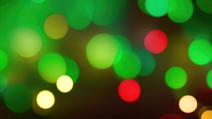 Obraz premium Abstract blur bokeh banner background. Gold bokeh on defocused Maroon and Green background