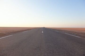 Long road across the salt lake of Chott El Jerid, Tunisia.