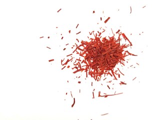 Very aromatic pieces of saffron on a white background.