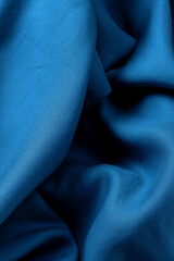 Blue fabric with waves and folds