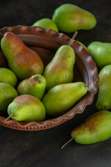 Parisian pear variety. Fruits on the table. Autumn harvest. Pears top view background. Green yellow red color pear. Vitamin vegan food.