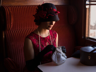 1920s woman in train compartment - 754888589