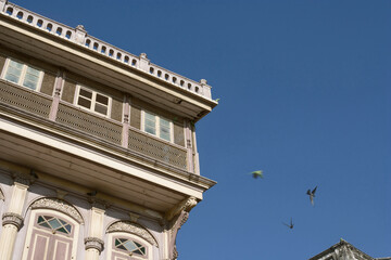 Khambhat, Gujarat / India - January 9, 2011 : Birds and the building in the city.