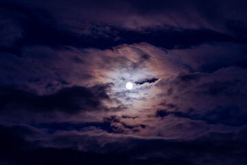 Fototapeta na wymiar moon in the clouds, blurry soft focus. 