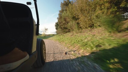 Golf club players driving on sport golf cart along the road through amazing green mowed lawns, sport game lovers and recreational concept