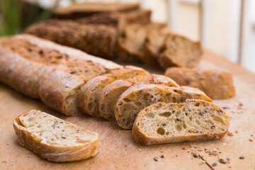 Fresh loaf of bread on wooden board