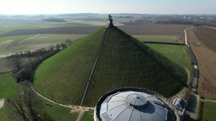 Lion's Mound with farm land around. Butte Du Lion on the battlefield of Waterloo where Napoleon was defeated. Drone aerial view