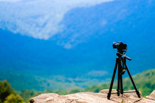 Camera on tripod with view point on mountain, Yellapur, Karnataka.