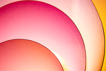 When I roll paper into many circles, I create a background with a sheet of paper and lights made up of different colors.
