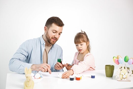 Girl With Down Syndrome Her Father Painting Easter Colored Eggs 4