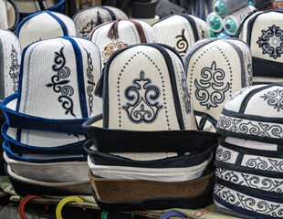 Kalpak, traditional Kyrgyz felt hat at the bazaar - 754914382