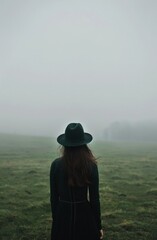 Foggy Landscape with Woman in Hat - obrazy, fototapety, plakaty