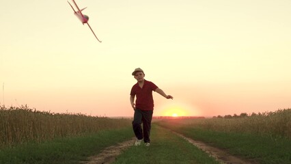 child kid boy Flying kite Bright sunset, children running flying kite Evening sky park sunset, boy...
