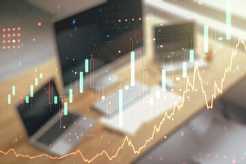 Multi exposure of abstract creative financial chart and modern desktop with laptop on background, research and analytics concept