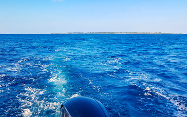 Motor engine of speedboat in the blue turquoise water Maldives.