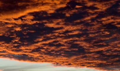 Fototapeta premium dramatic Red clouds for pattern background. A burning sky in a horror movie. crimson storm in apocalyptic, judgment day.
