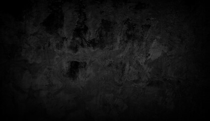 Black concrete wall background of a building with scratches and cracks. wall texture background
