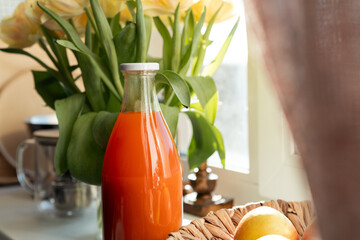 Сlose-up of a bottle of carrot juice. Healthy drinks for the human body