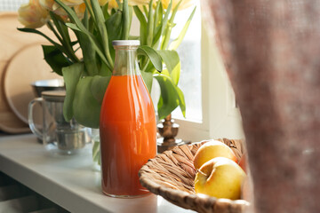 Close up of fresh and healthy detox drink in a bottle. Carrot juice