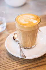 A Perfect Morning: Creamy Latte Art in a Cozy Cafe
