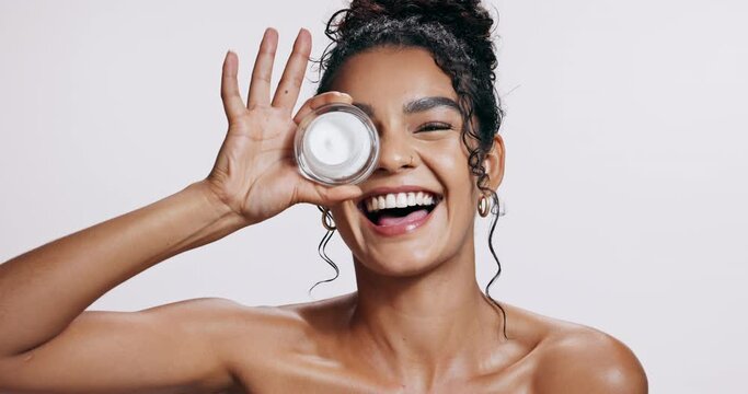 Woman, cream and laugh for skincare, anti aging and hydration mask in studio on white background. Female person, flawless skin or glow for application of spf dermatology product for sun protection