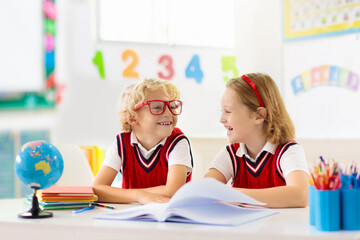 Kids doing homework. Children go back to school.