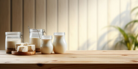 Fototapeta na wymiar Dairy products in glass bottles stand on an empty wooden.Template for product demonstration and presentation.