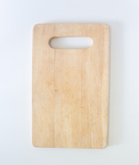 Wooden cutting board in top view, closed up shot on white background.