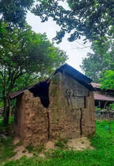 Old local traditional house, made of soil. Concept of poverty, primitive homes, poor simple settlements in villages. Old and broken soil made home.